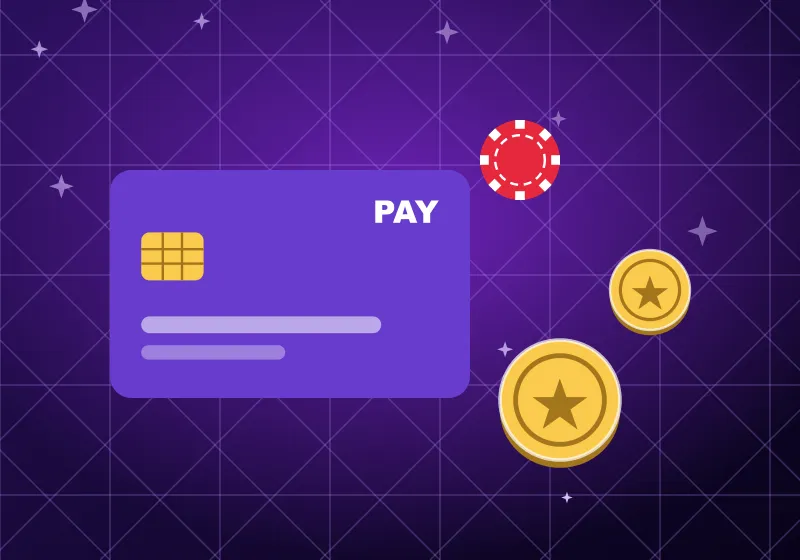 Payment card with coins and a casino chip on purple